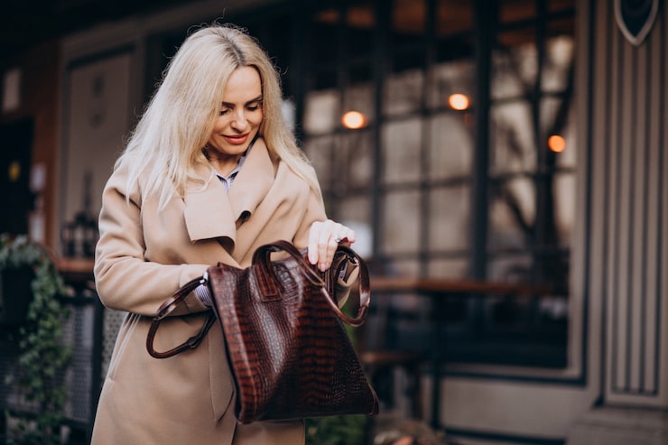 Woman walking with an oversized soft-structured leather tote bag
